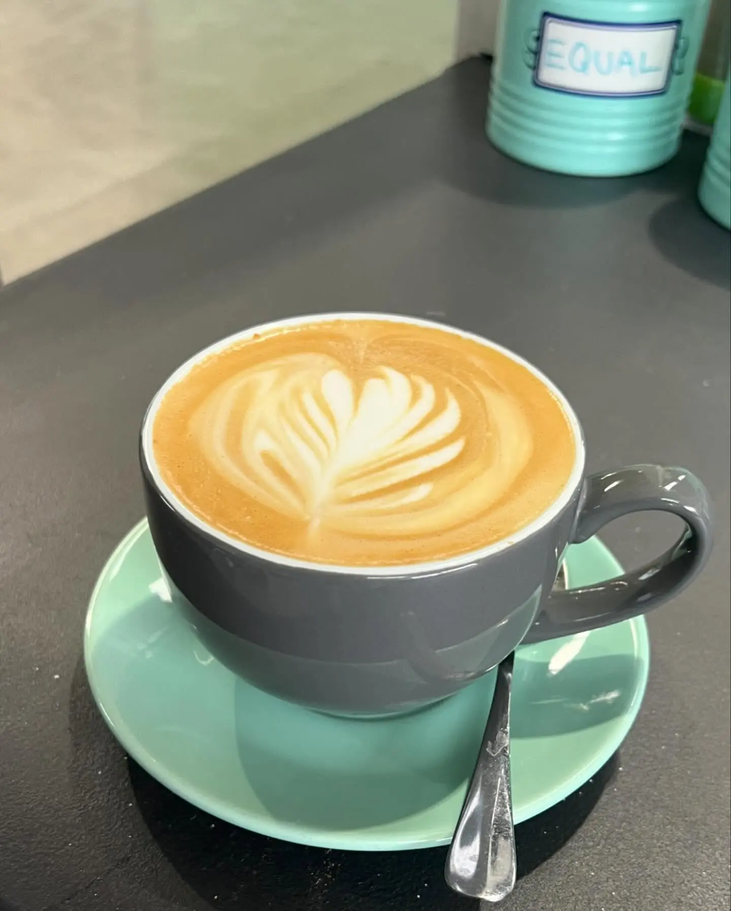 Flat white with latte art on the table at the Meerkat Manner cafe, Ocean Grove